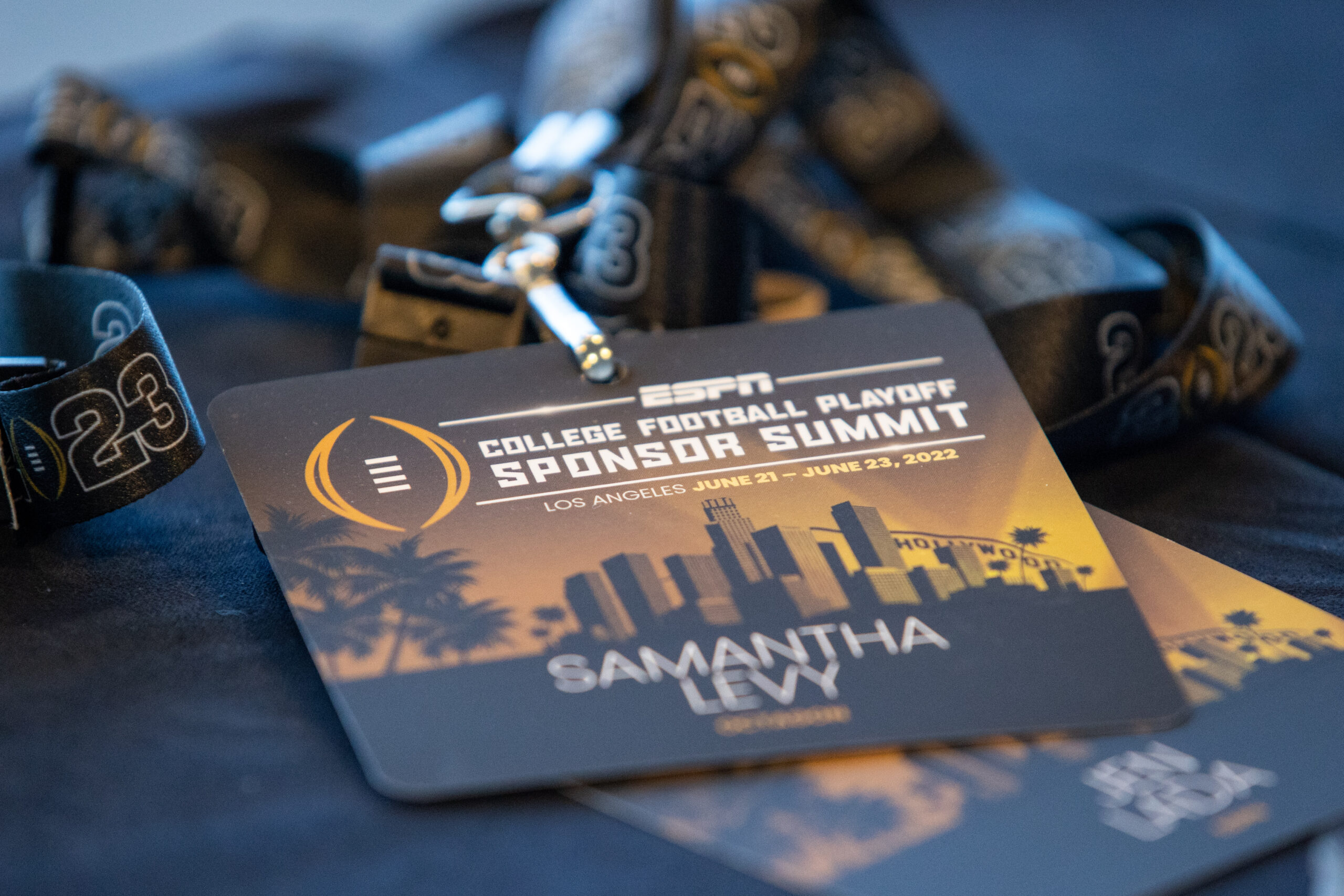 Los Angeles, CA - June 22, 2022 - JW Marriott: Credentials provided at the 2022 College Football Playoff Sponsor Summit Breakfast and Check-In.(Photo by Melina Pizano / ESPN Images)
